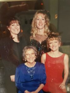 Dr. Sorrenson, bottom row, right, (as you are looking at photo) with her mother beside her and sister behind. Dr. Sorrenson's mother's advice to "Be somebody," has helped her both personally and professionally.